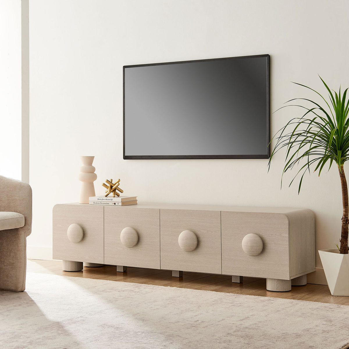 Ash Sonnet media console styled beneath a wall-mounted TV in a bright modern living room || EEI-7011-ASH || front_angle_room