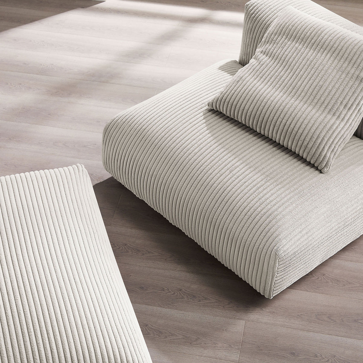 Ribbed corduroy upholstery with plush cushioning and softly rounded edges || EEI-7022-ALM || detail_room