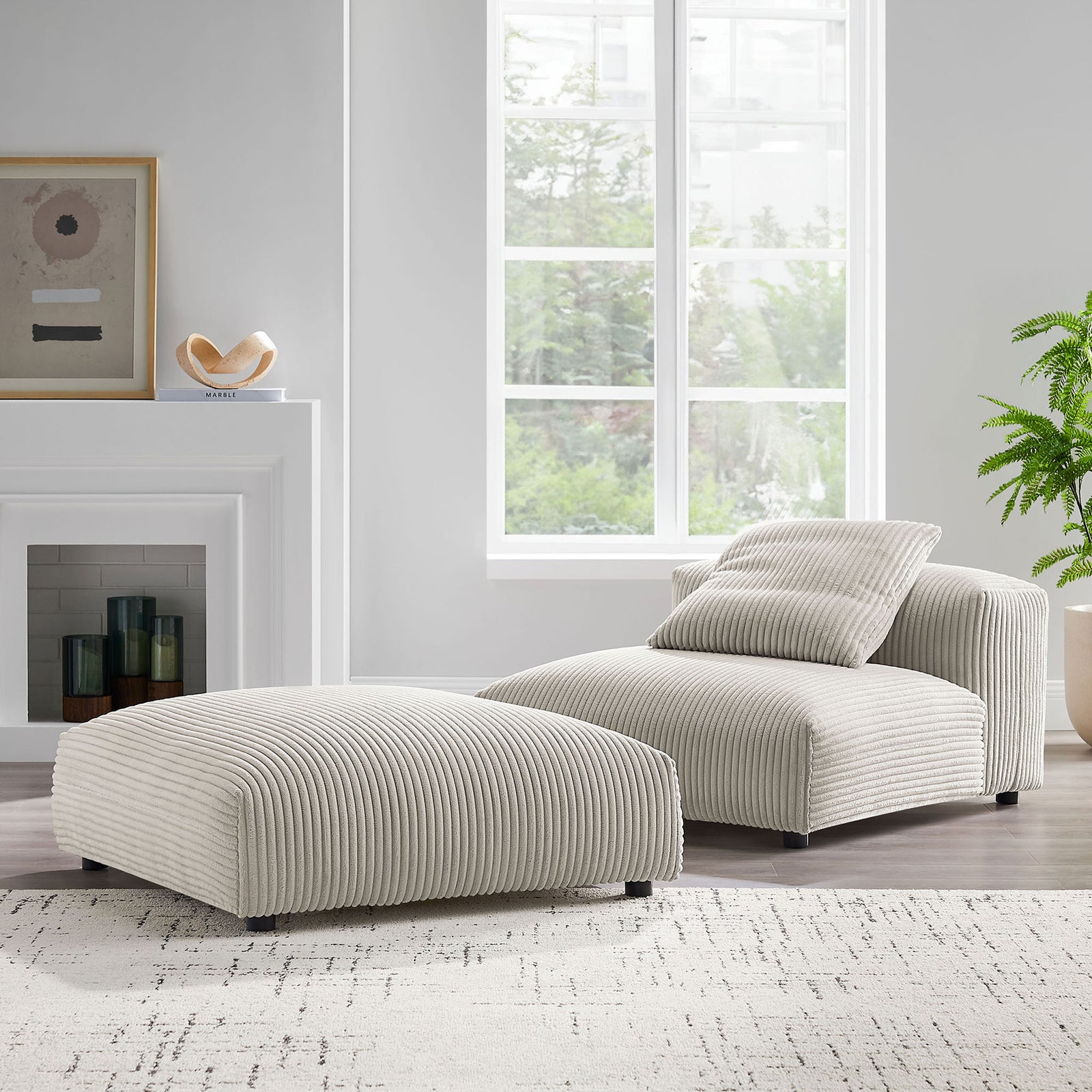 Almond corduroy armless chair and ottoman bring inviting texture to a bright, modern living room || EEI-7022-ALM || front_angle_room