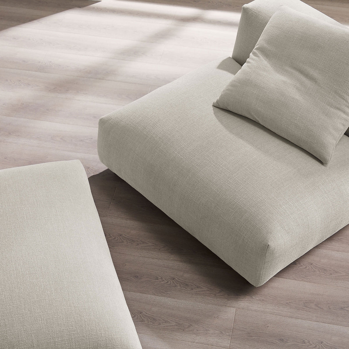 Soft, textured upholstery and plush cushioning invite laid-back lounging || EEI-7023-LIN || detail_room