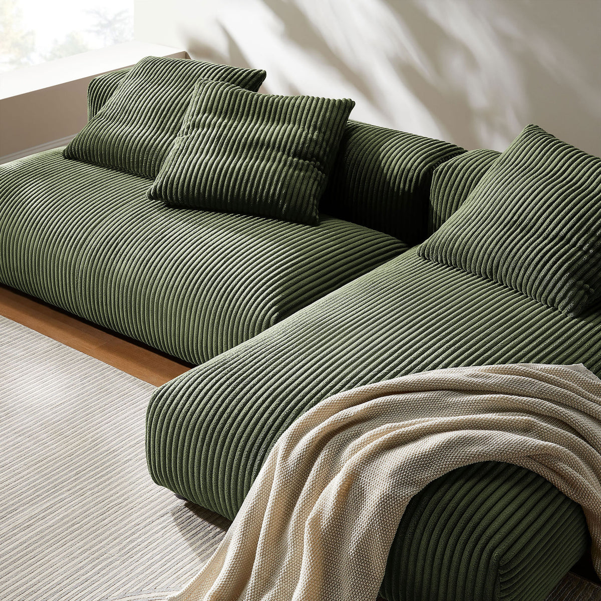 Plush fern corduroy sectional chaise styled with textured throw and cozy accent pillows || EEI-7024-FRN || detail_room