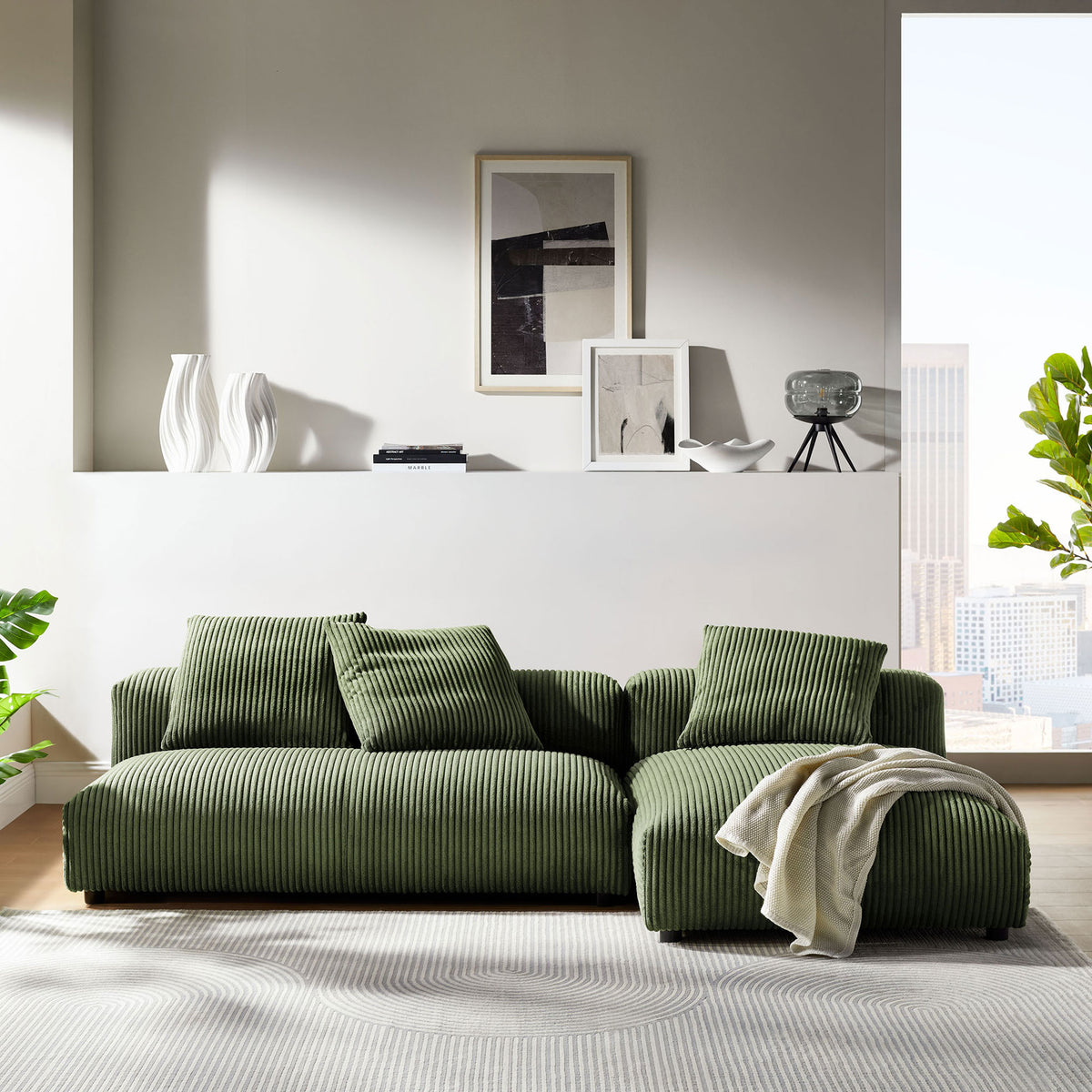 Fern corduroy modular sectional with chaise arranged in a bright modern living room || EEI-7024-FRN || front_angle_room