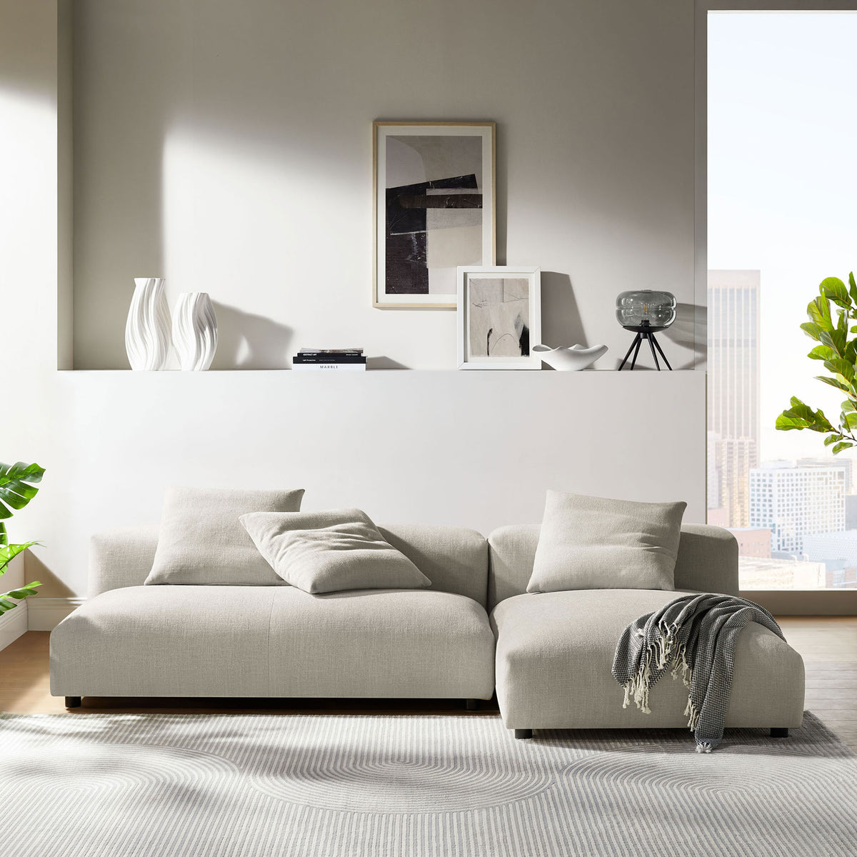 Linen modular sectional sofa with chaise styled in a bright modern living room || EEI-7025-LIN || front_room