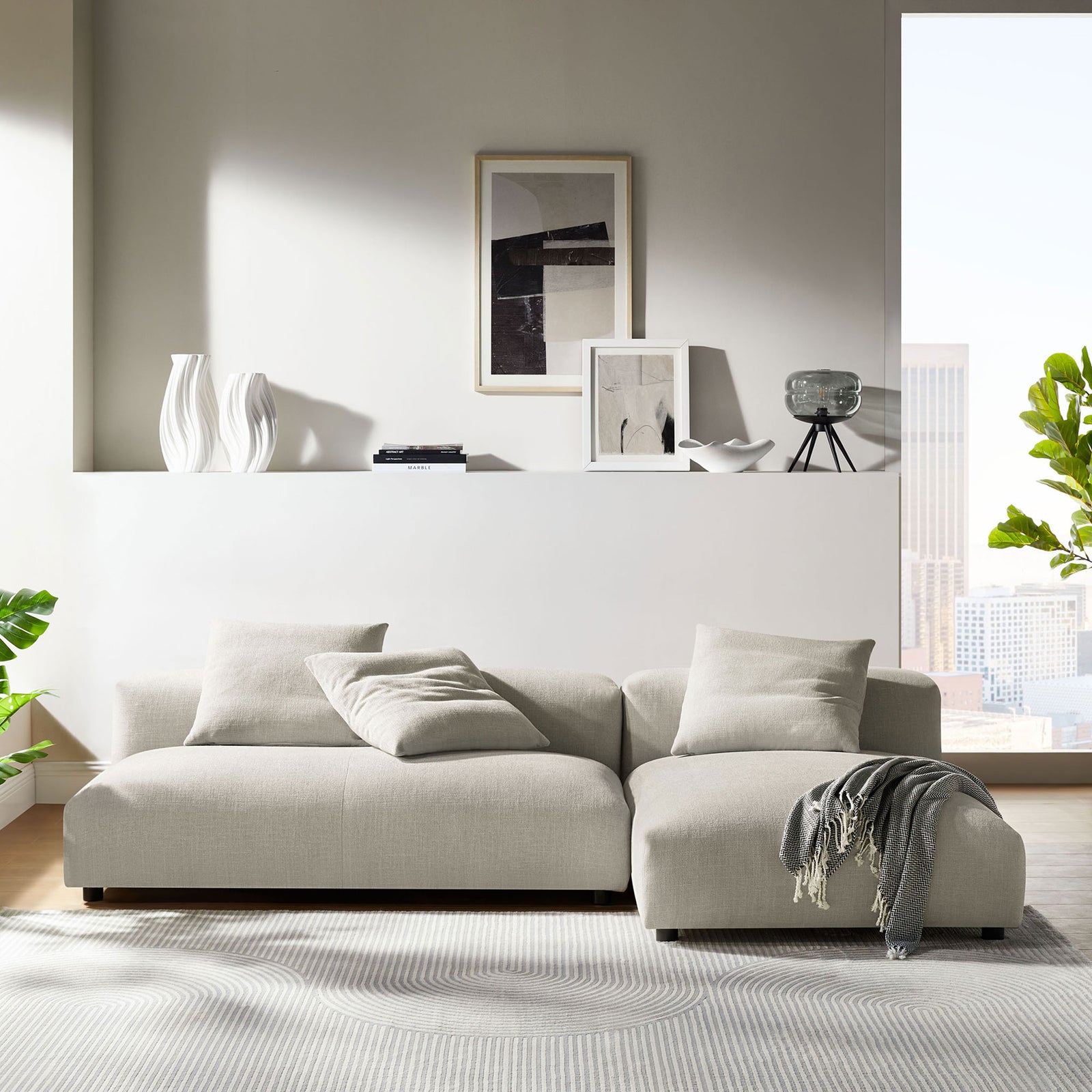 Linen modular sectional sofa with chaise styled in a bright modern living room || EEI-7025-LIN || front_room