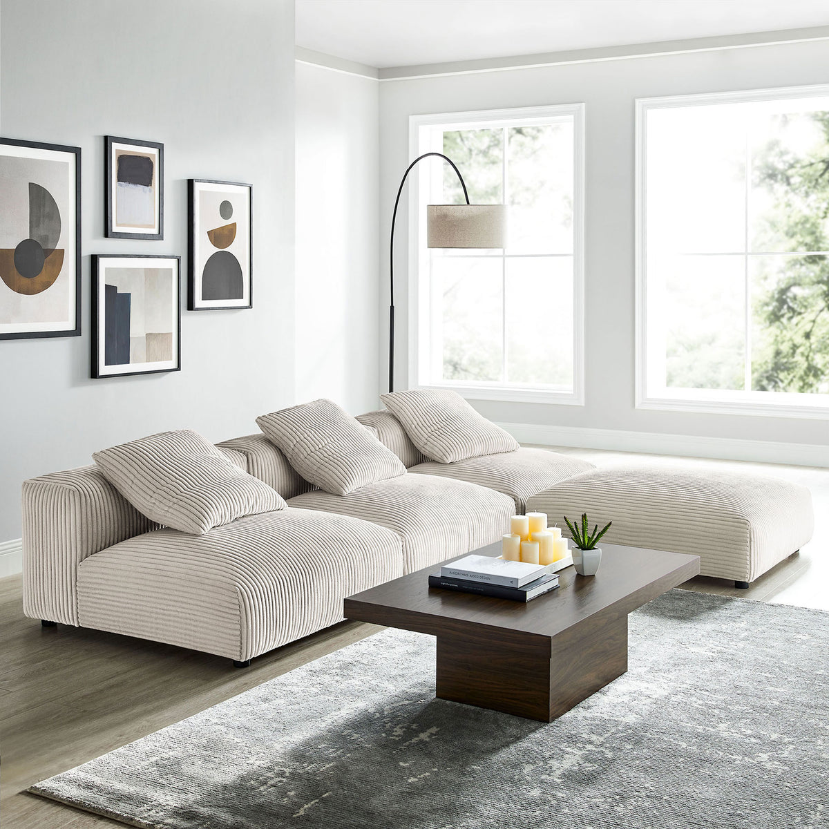 Solace almond corduroy sectional creating an inviting corner lounge beside a contemporary coffee table || EEI-7026-ALM || front_angle_room