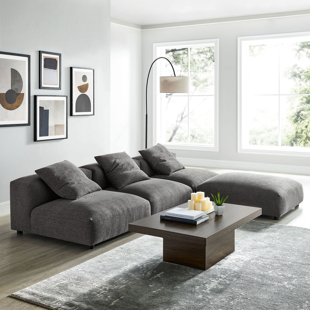 L-shaped charcoal Solace sectional creates a cozy lounge corner with deep cushions and woven fabric texture || EEI-7027-CHA || front_angle_room