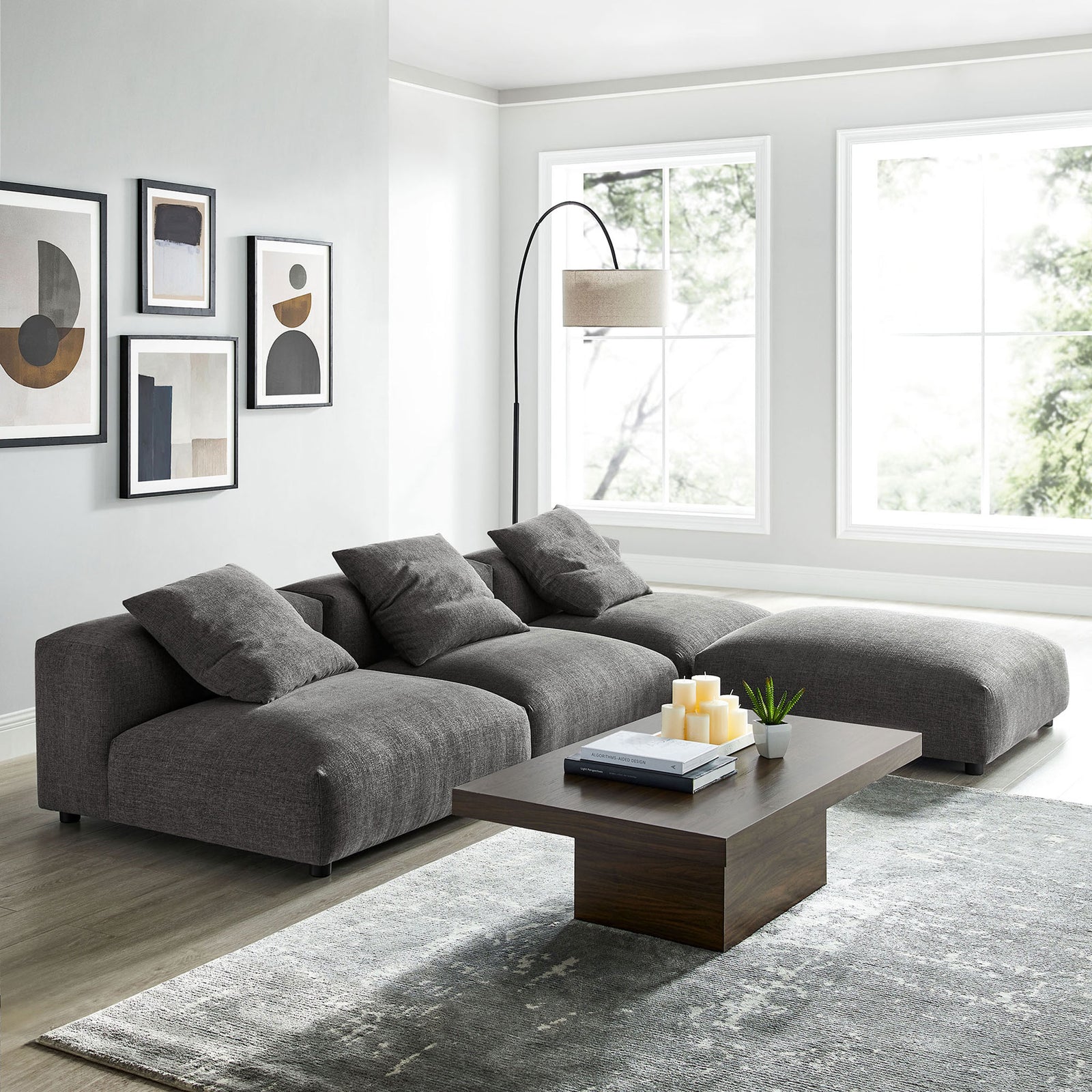 L-shaped charcoal Solace sectional creates a cozy lounge corner with deep cushions and woven fabric texture || EEI-7027-CHA || front_angle_room