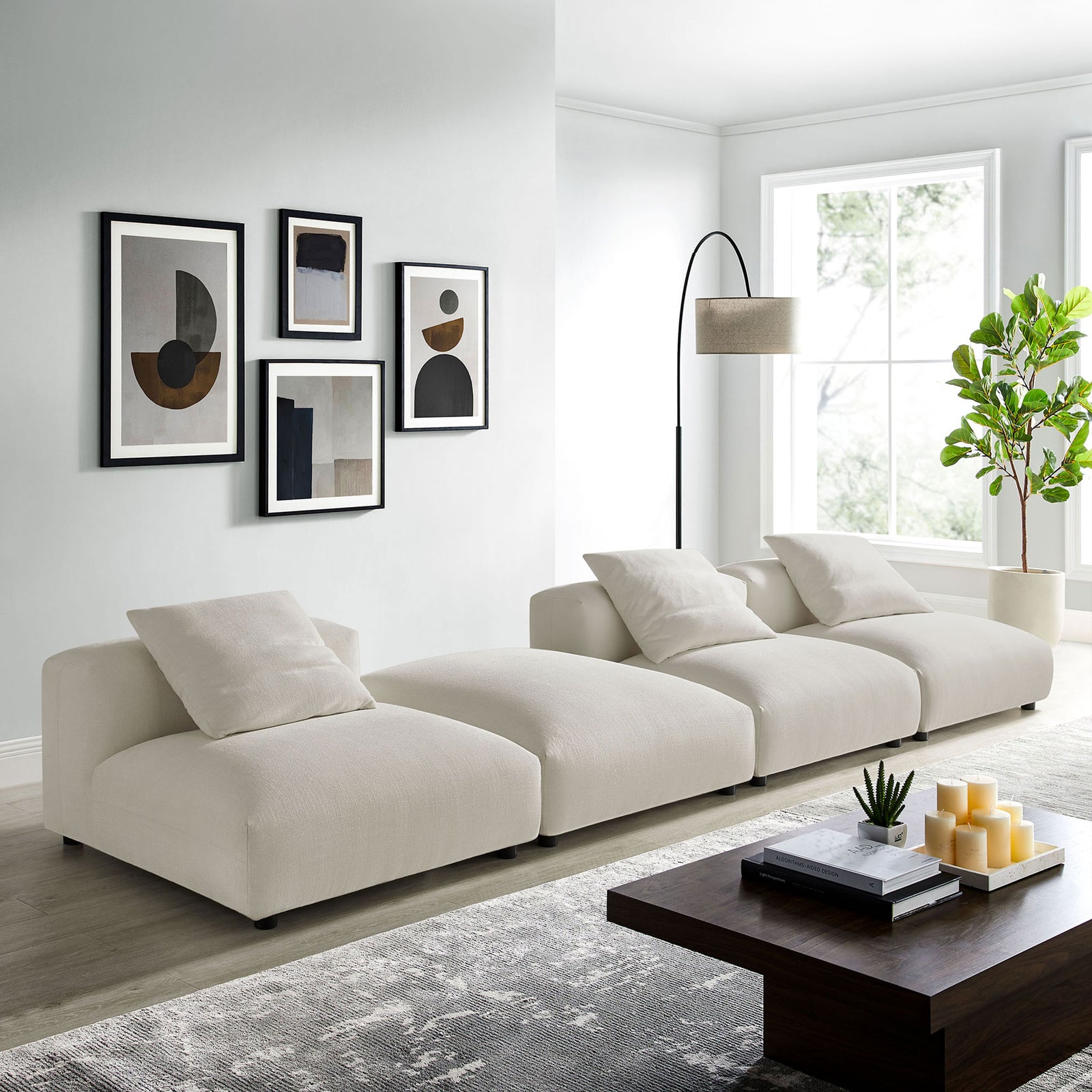 Four-piece modular sectional in a bright living room showcasing its low profile and generous seating space || EEI-7027-SAL || front_angle_room