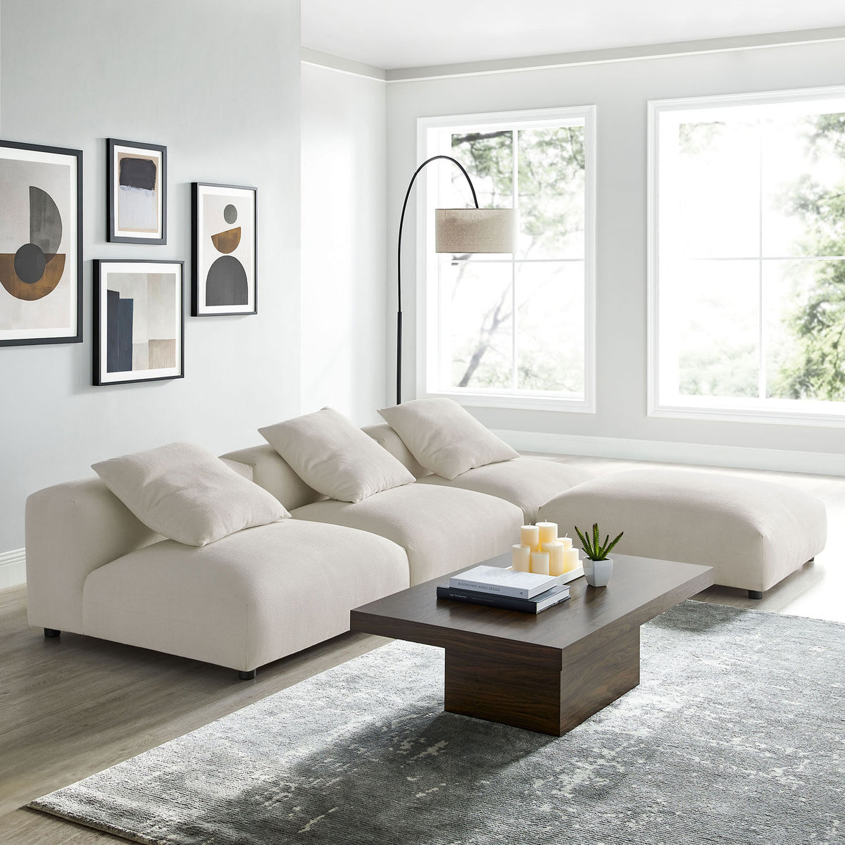 L-shaped modular sectional in salt fabric styled with a modern coffee table and minimalist decor || EEI-7027-SAL || front_angle_room