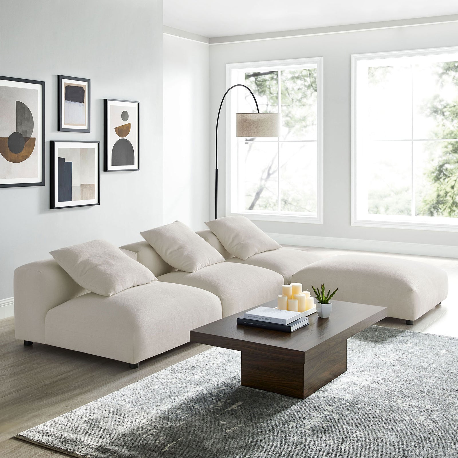 L-shaped modular sectional in salt fabric styled with a modern coffee table and minimalist decor || EEI-7027-SAL || front_angle_room