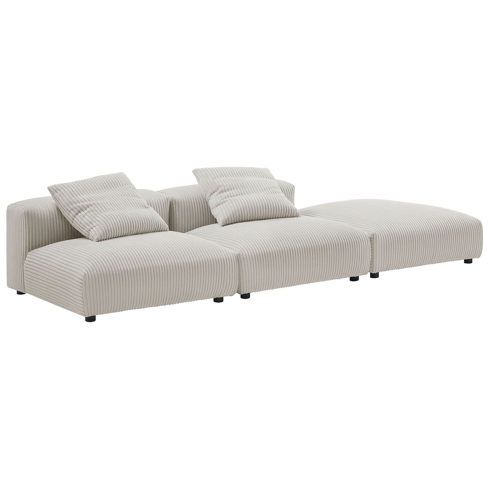 Flexible corduroy sectional arranged for relaxed lounging with deep seats and plush pillow backs || EEI-7028-ALM || front_angle_studio