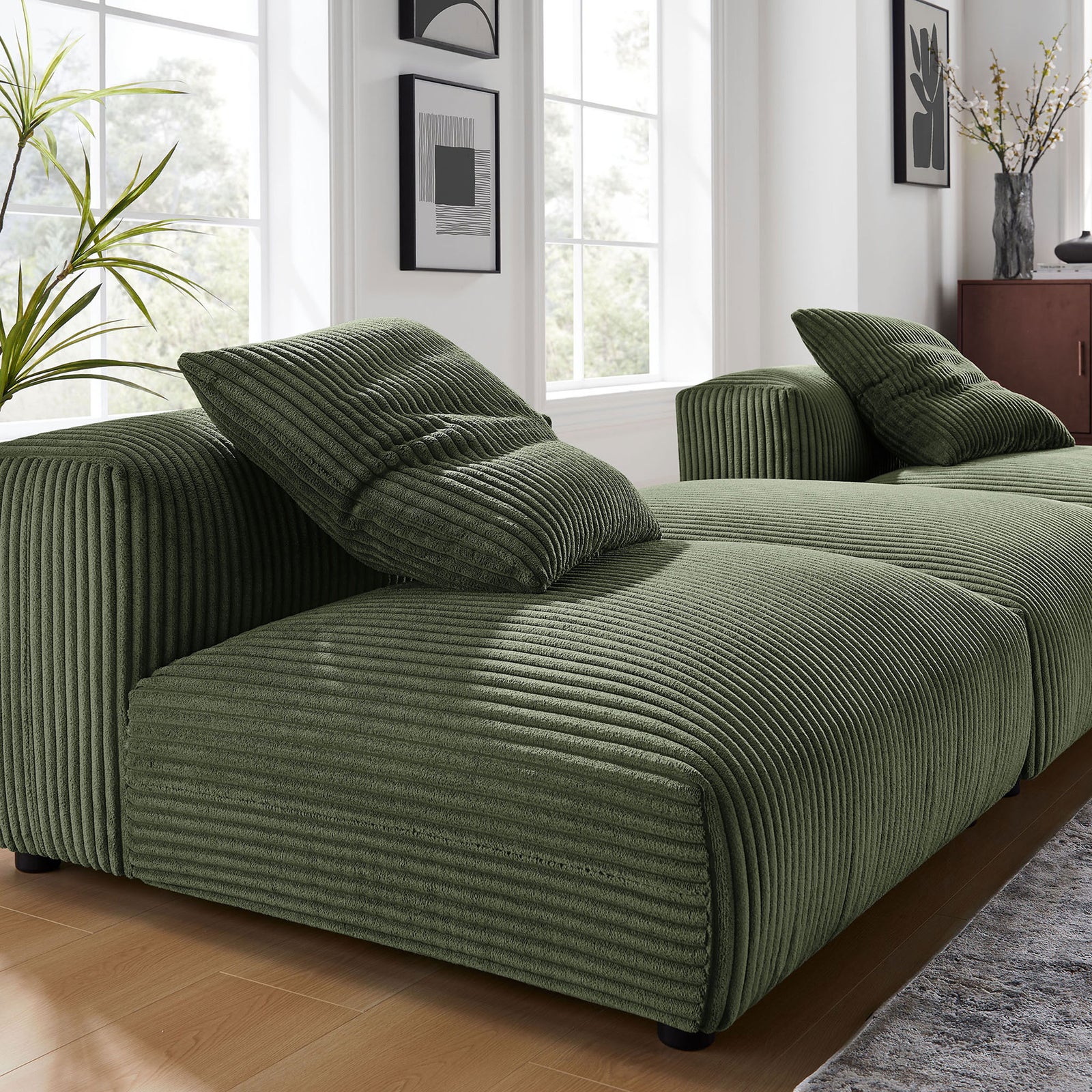 Fern corduroy modular sectional styled in a bright living room, highlighting deep ribbed texture and soft pillows. || EEI-7028-FRN || detail_room