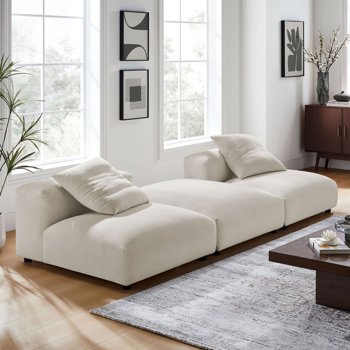 Salt modular sectional sofa styled in a bright living room with rug, coffee table, and accent pillows || EEI-7029-SAL || front_angle_room