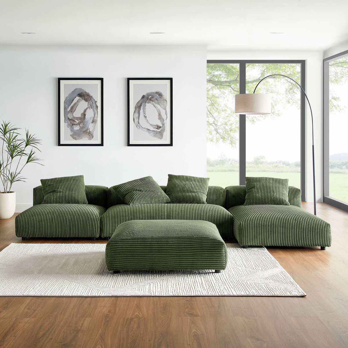 Fern green corduroy sectional and ottoman styled in a contemporary living room with decor || EEI-7032-FRN || front_angle_room