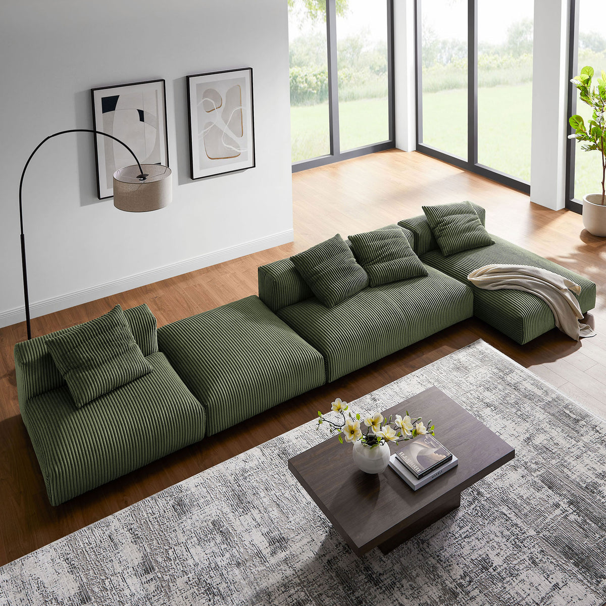 Sectional reconfigured as a long lounge layout beside coffee table and layered rugs || EEI-7032-FRN || top_angle_room