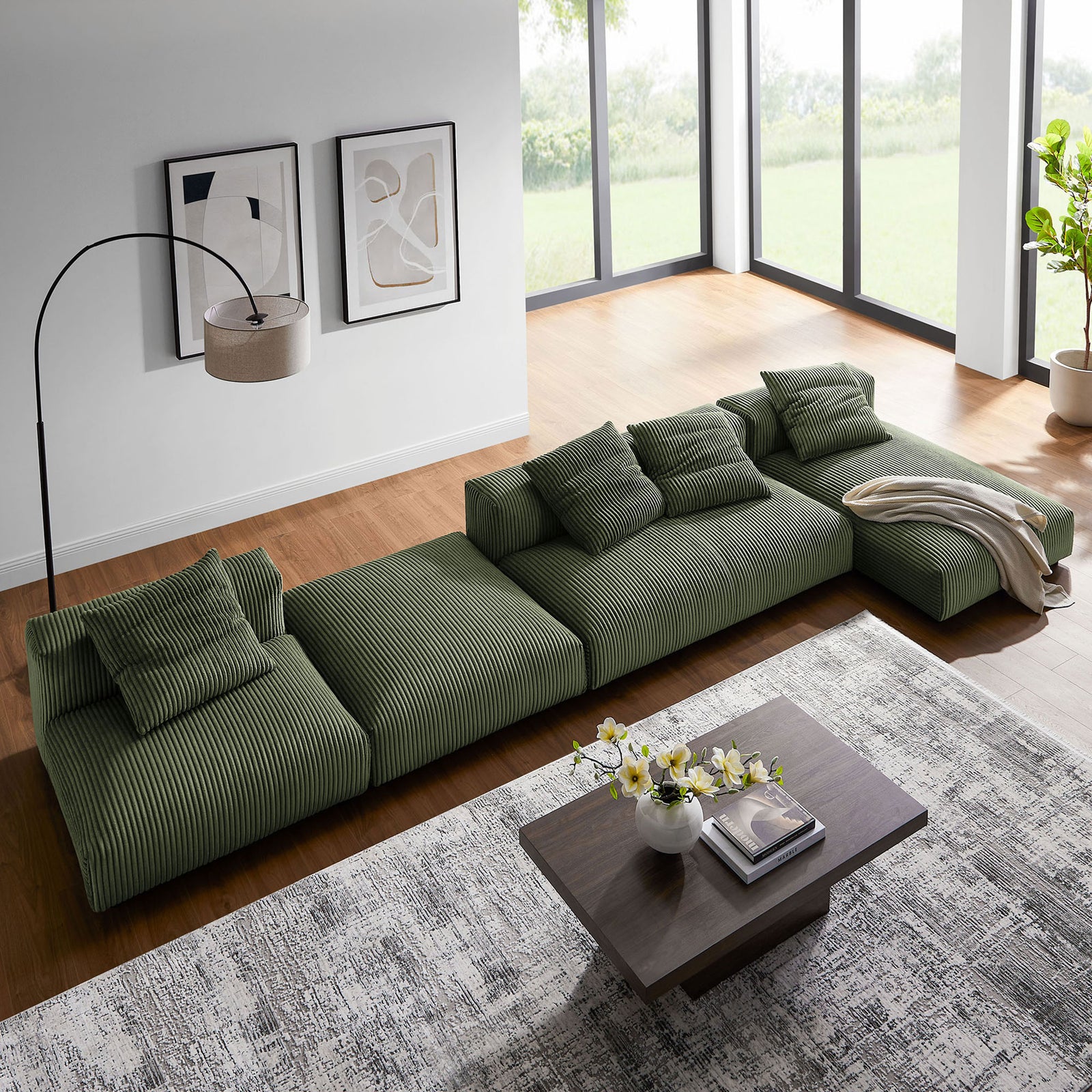 Sectional reconfigured as a long lounge layout beside coffee table and layered rugs || EEI-7032-FRN || top_angle_room