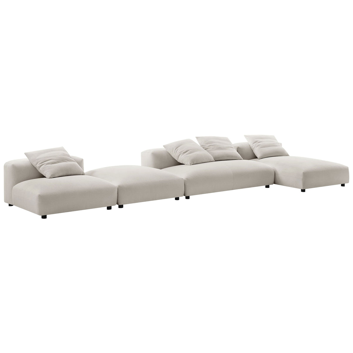 Flexible salt fabric modular seating arranged in a long low profile configuration with plush back cushions || EEI-7033-SAL || front_angle_studio