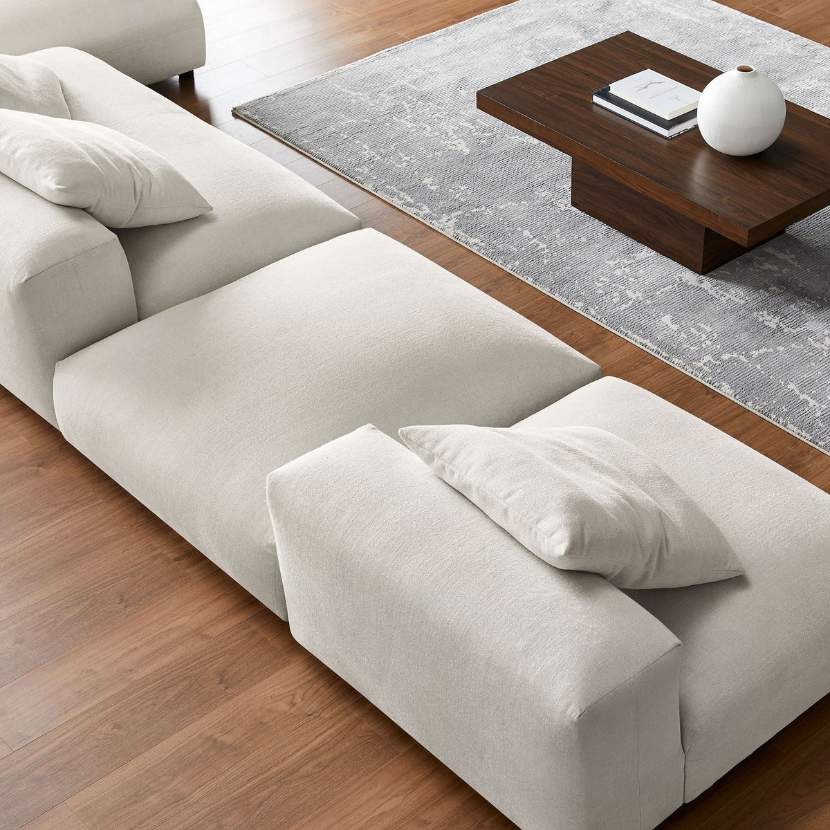 Close up of the salt textured woven upholstery showcasing the generous seat cushions and clean modern lines || EEI-7033-SAL || detail_room