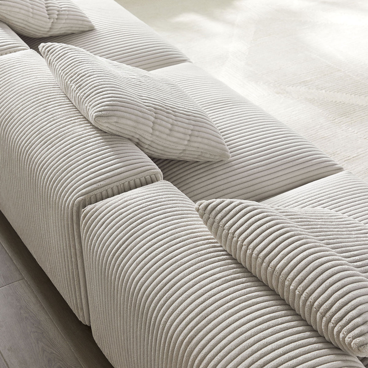 Soft ribbed almond corduroy upholstery with plush cushioning and coordinating throw pillows for relaxed lounging || EEI-7034-ALM || swatch_room