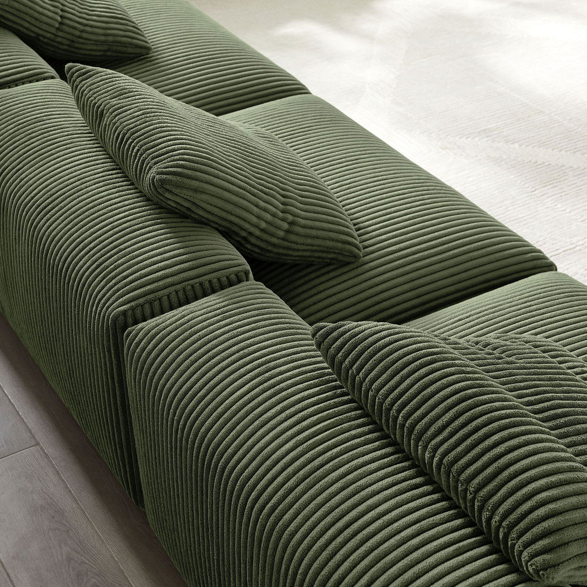 Textured fern green corduroy ribs and accent pillows on the Solace modular sofa || EEI-7034-FRN || swatch_room