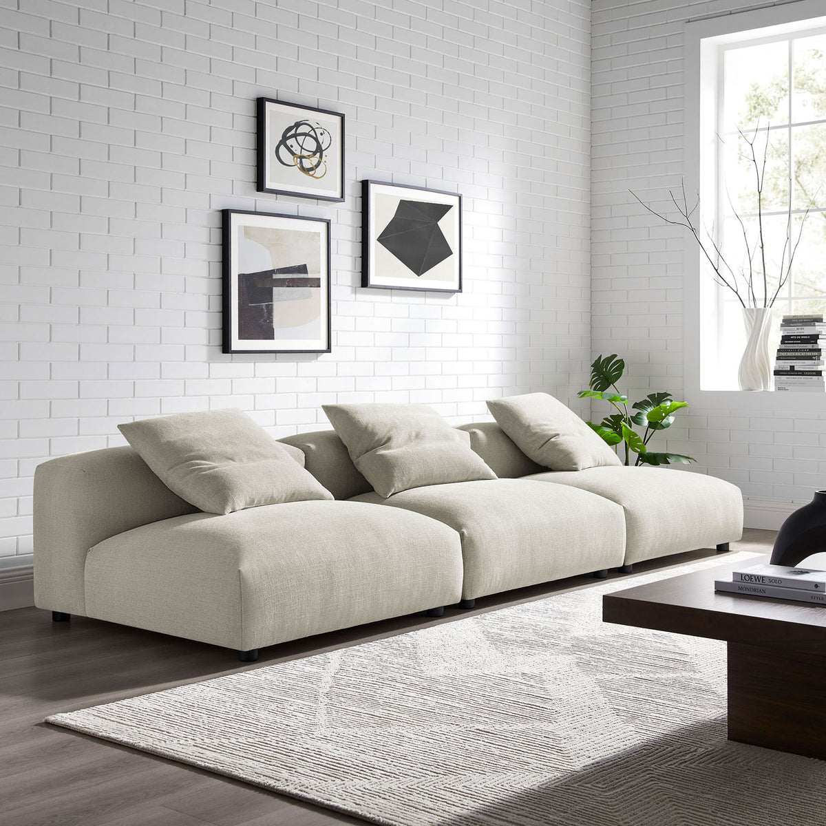 Modular linen sofa styled in a bright living room with accent pillows and low-profile silhouette || EEI-7035-LIN || front_angle_room