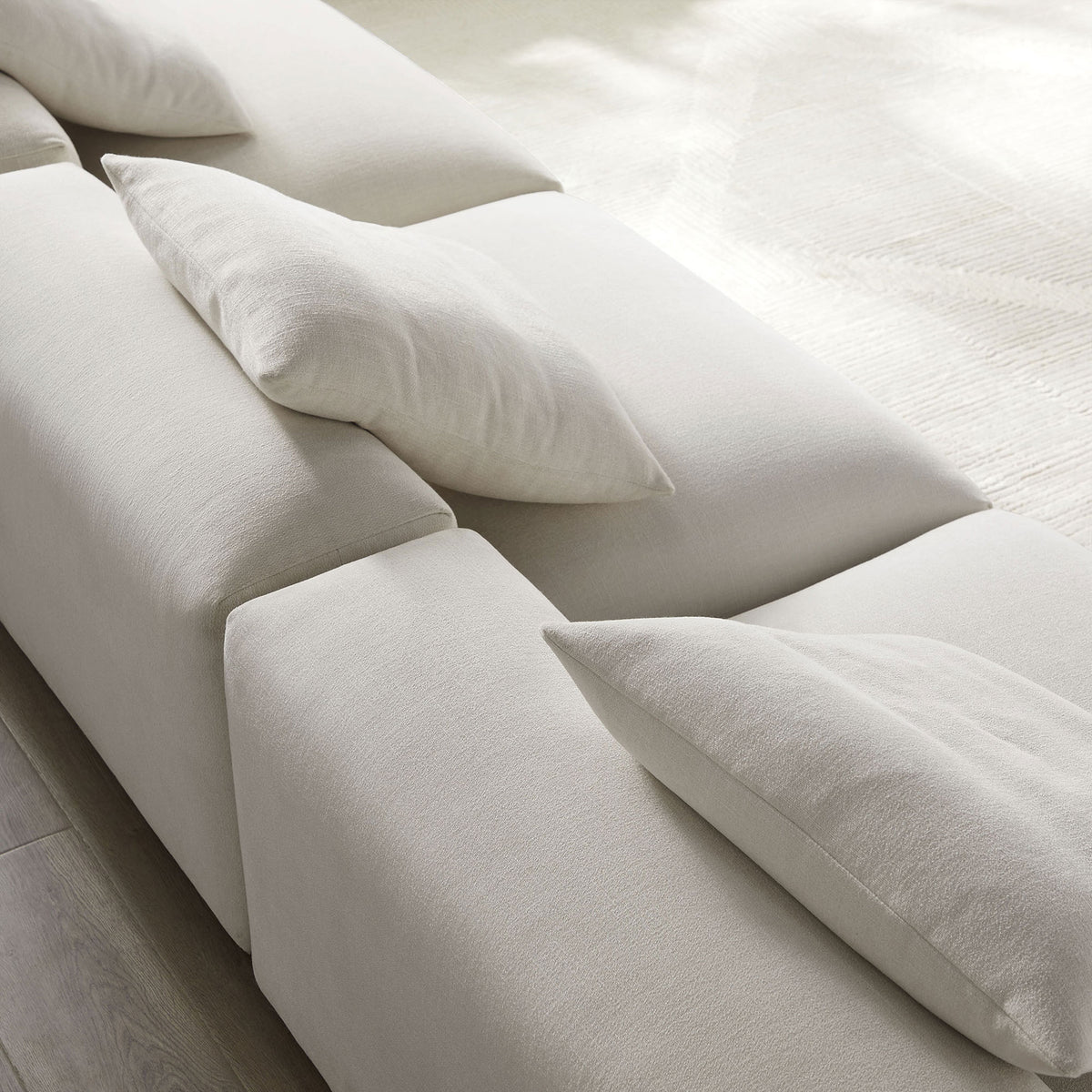 Solace modular sofa in salt fabric with textured woven upholstery and overstuffed accent pillows || EEI-7035-SAL || detail_room