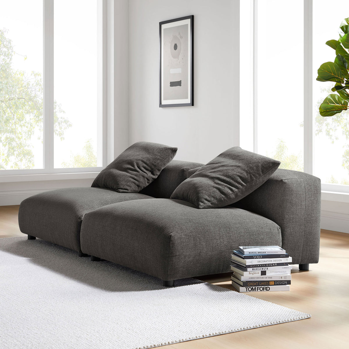 Charcoal modular sofa brings cozy, low-profile seating to a bright, modern living room setting || EEI-7037-CHA || front_angle_multi_room