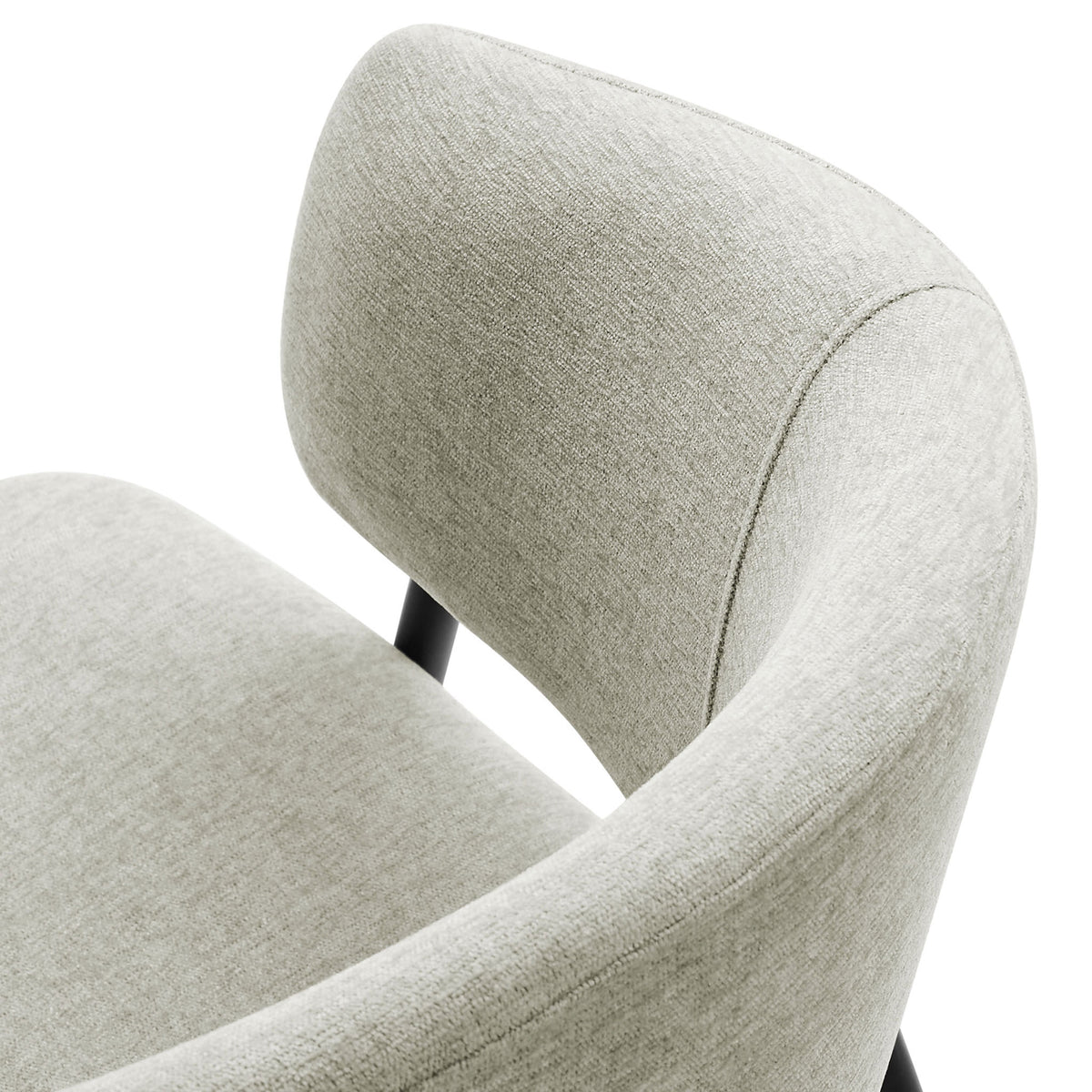 Soft heathered chenille fabric and smooth curved backrest detail of the dining chair. || EEI-7045-TAU-BLK || detail_studio