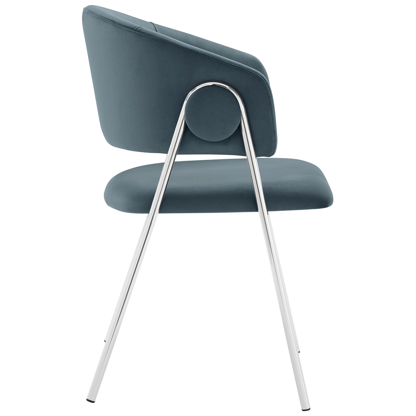 Velvet dining chair showcasing its slim silhouette, round side accent, and sleek metal frame. || EEI-7046-CAD-SLV || side_studio
