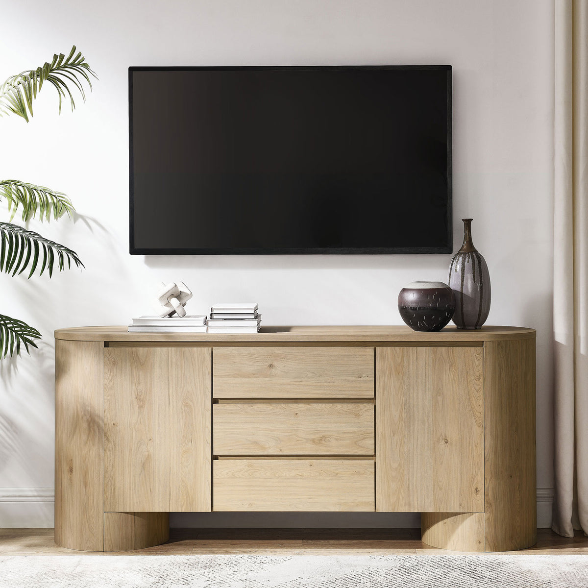 Duval sideboard styled as a media console beneath a wall-mounted TV with decorative accents on top || EEI-7050-HCK || front_angle_room