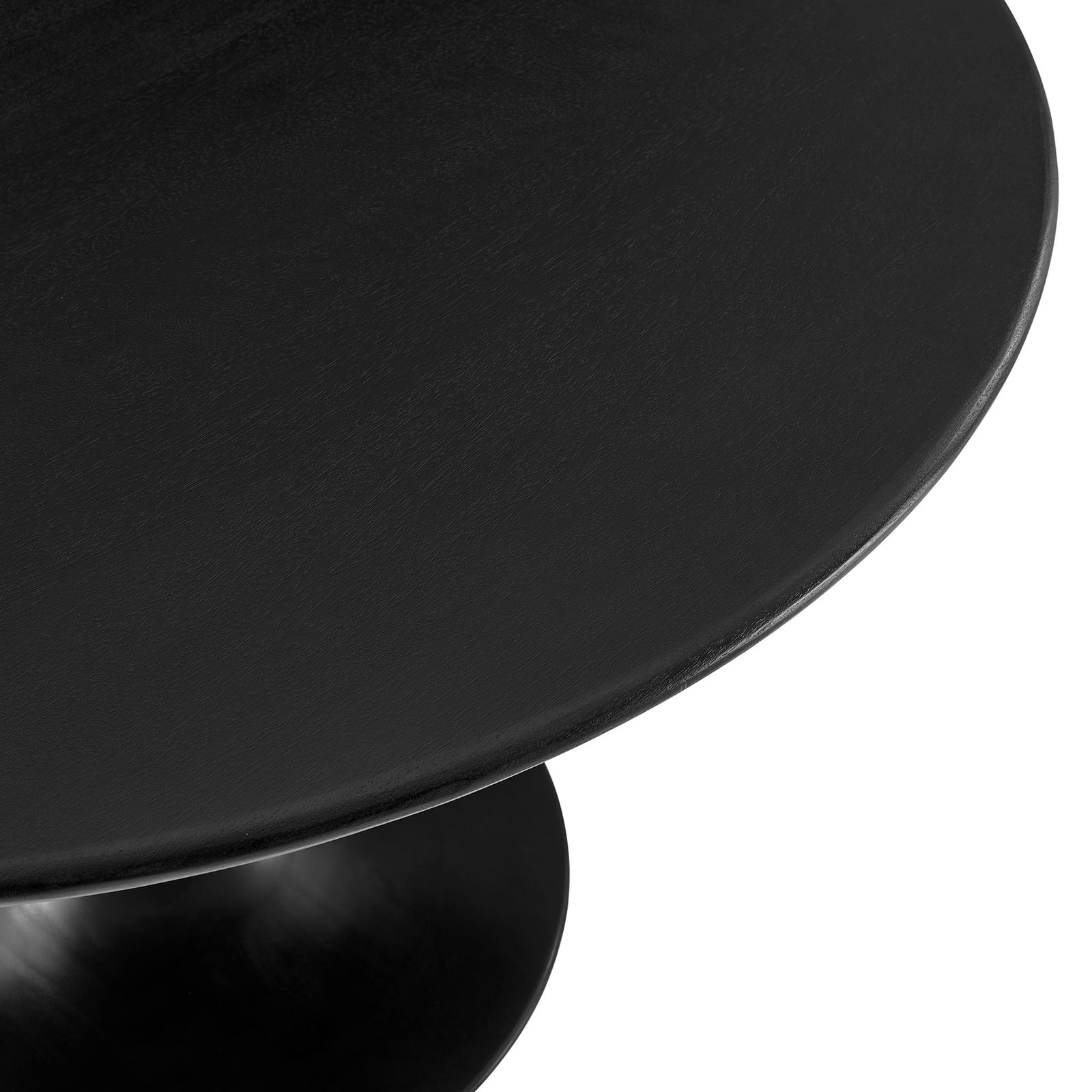 Black solid wood tabletop showing fine grain and a softly rounded edge above the pedestal base || EEI-7051-BLK || detail_studio