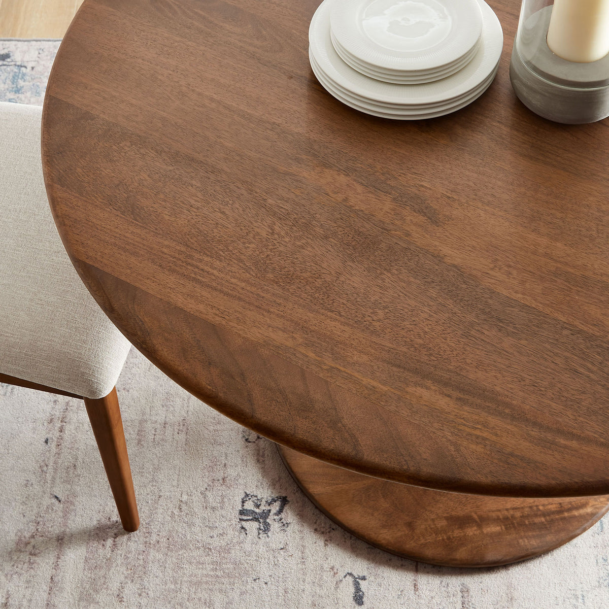 Walnut dining tabletop styled with neutral dinnerware adds inviting warmth to a modern dining space. || EEI-7051-WAL || detail_room