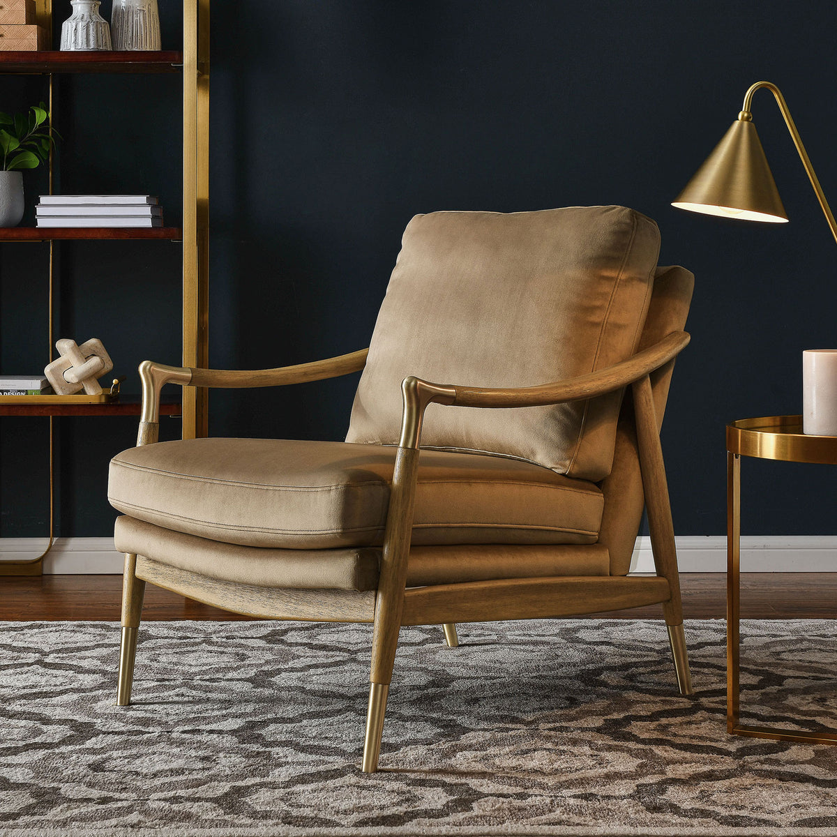 Inviting lounge chair pairs plush velvet cushions with a walnut frame and elegant brass accents || EEI-7056-TAU-WAL || front_angle_room