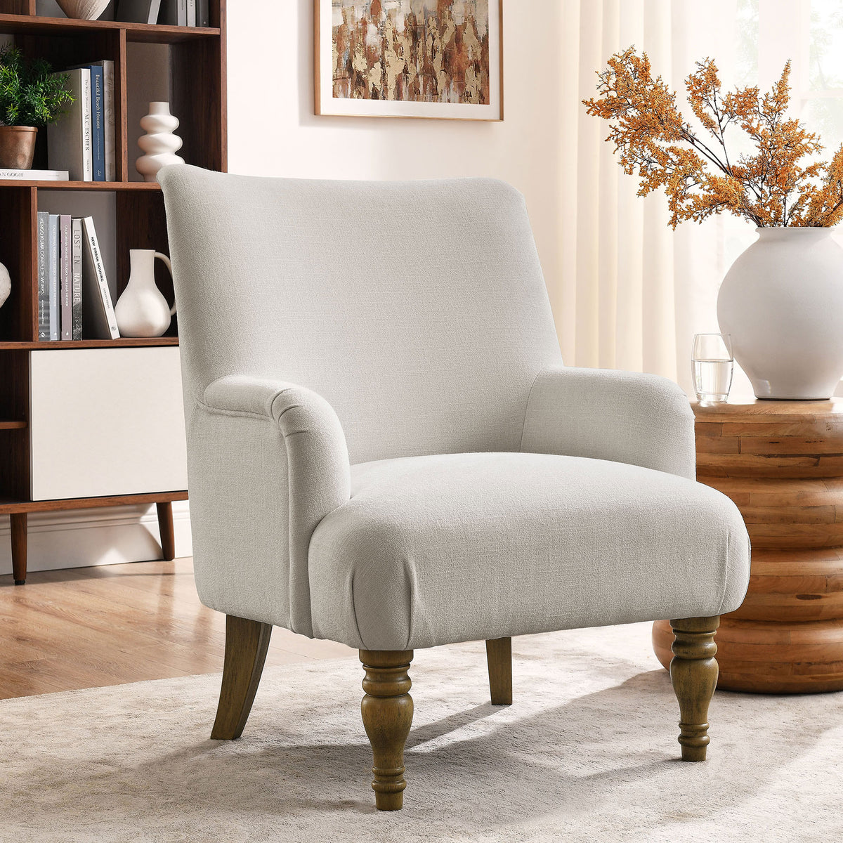 Inviting neutral chair warms your room with plush seat, refined piping, and natural wood legs. || EEI-7057-SAL || front_angle_room