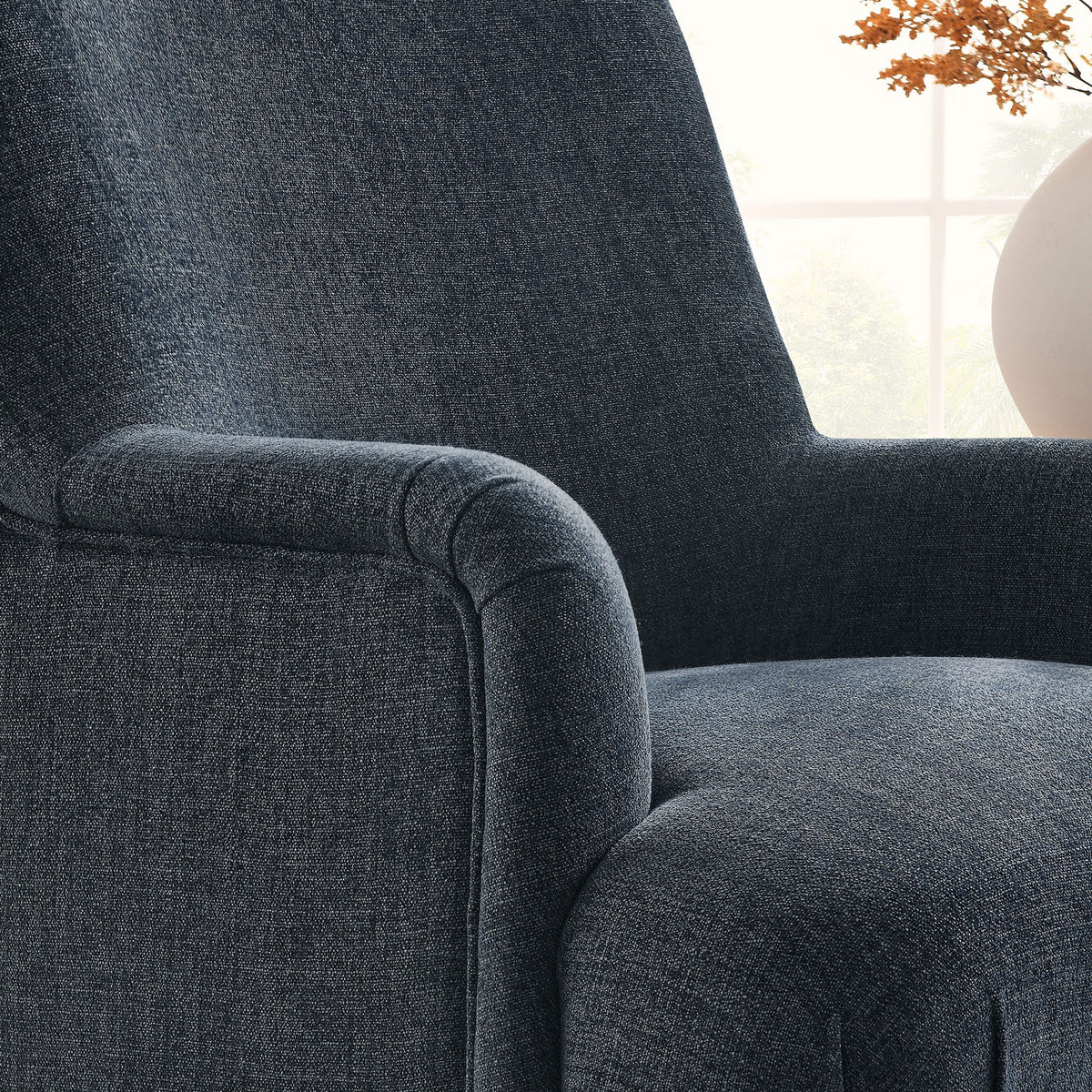 Rich slate blue fabric and French piping bring texture and polish to the arm and seat || EEI-7057-SLB || detail_room