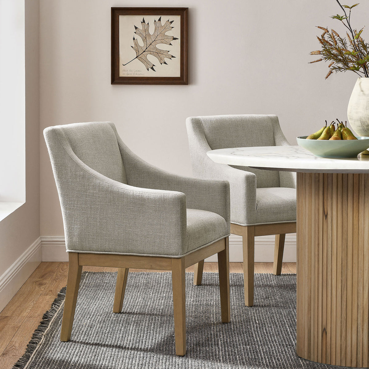 Alton linen armchairs styled around a round dining table for an inviting contemporary dining room || EEI-7058-LIN-NAT || front_angle_room