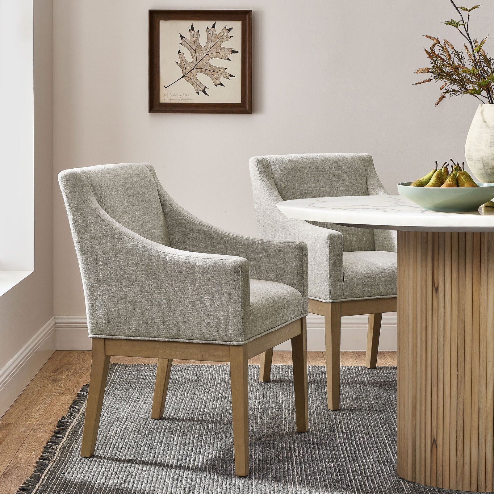 Alton linen armchairs styled around a round dining table for an inviting contemporary dining room || EEI-7058-LIN-NAT || front_angle_room