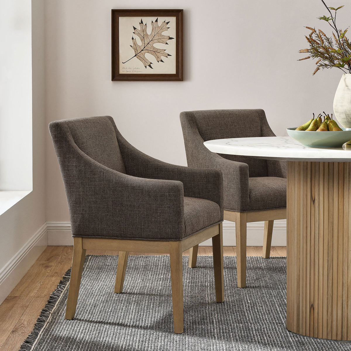Mocha dining armchairs styled around a round table in a bright contemporary dining room || EEI-7058-MOC-NAT || front_angle_room