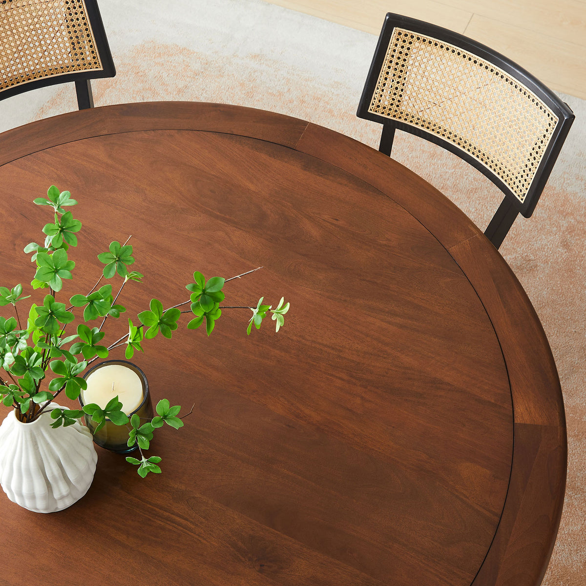 Walnut finished round tabletop styled with greenery and candle, showcasing the smooth grain and beveled edge. || EEI-7071-BLK-WAL || detail_room