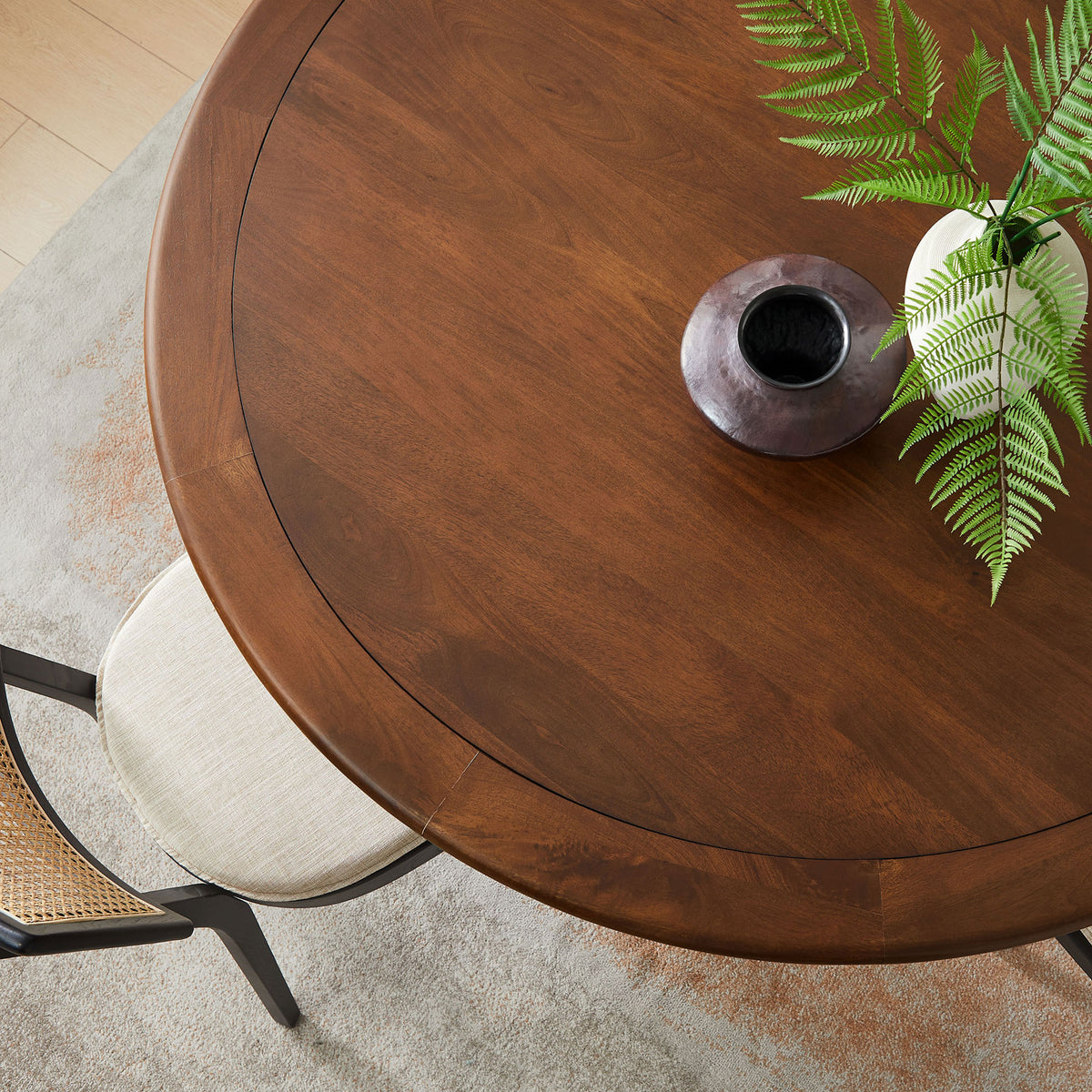 Walnut dining tabletop styled with vases and greenery, emphasizing the spacious surface and warm, inviting finish || EEI-7071-BRA-WAL || detail_room