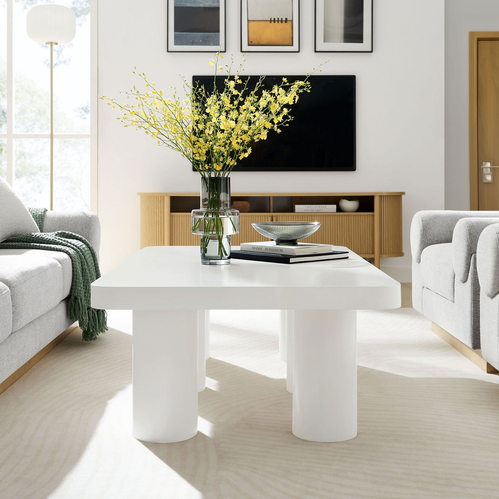 Spacious white coffee table adds crisp contrast and modern geometry to a bright living room || EEI-7072-WHI || side_room