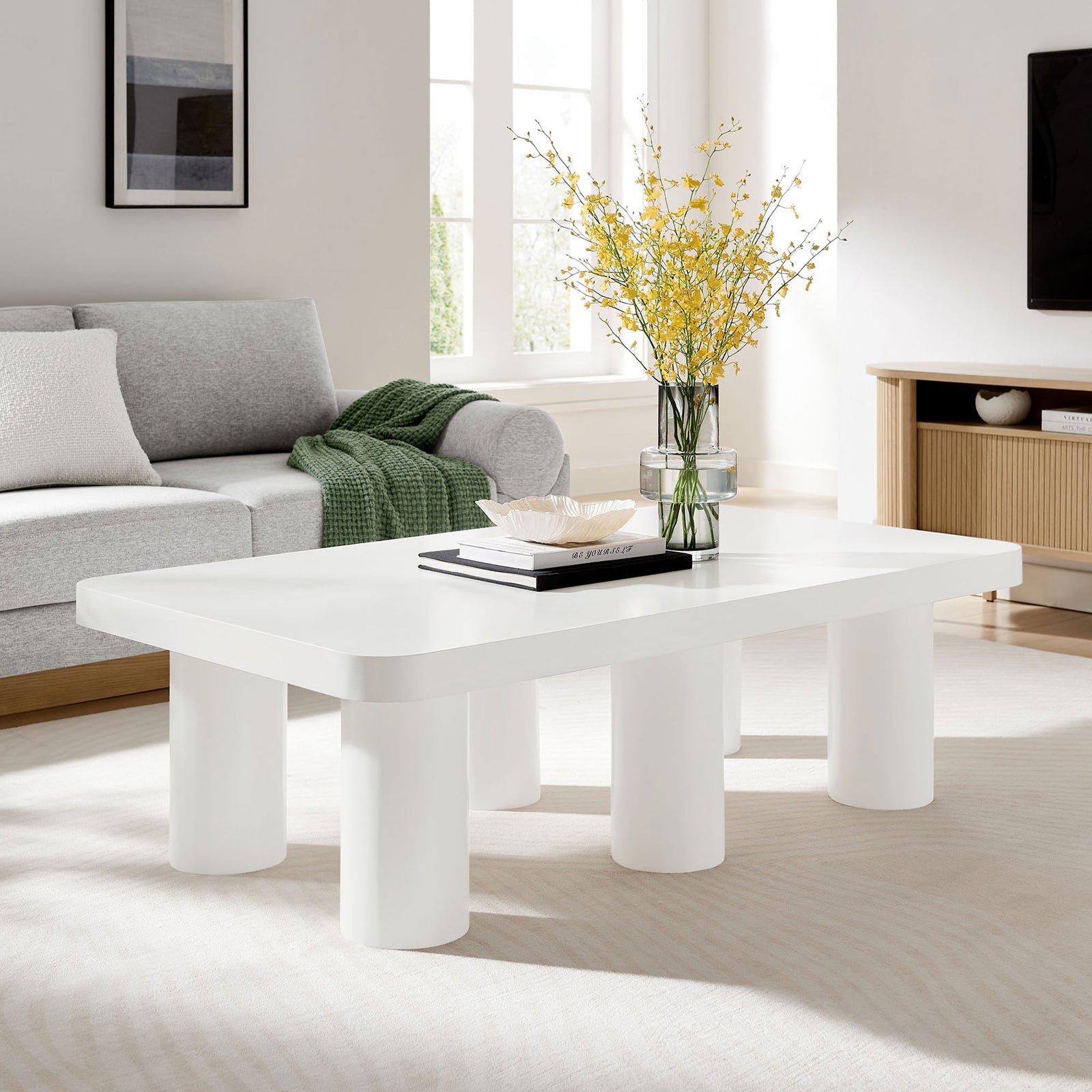 Clean-lined white rectangle table anchors the seating area with bold six-leg silhouette || EEI-7072-WHI || front_angle_room