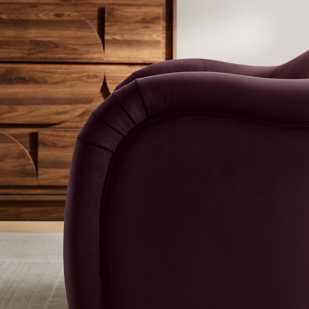 Rich mulberry performance velvet with graceful pleats and piping adds refined texture || EEI-7074-MUL || detail_room