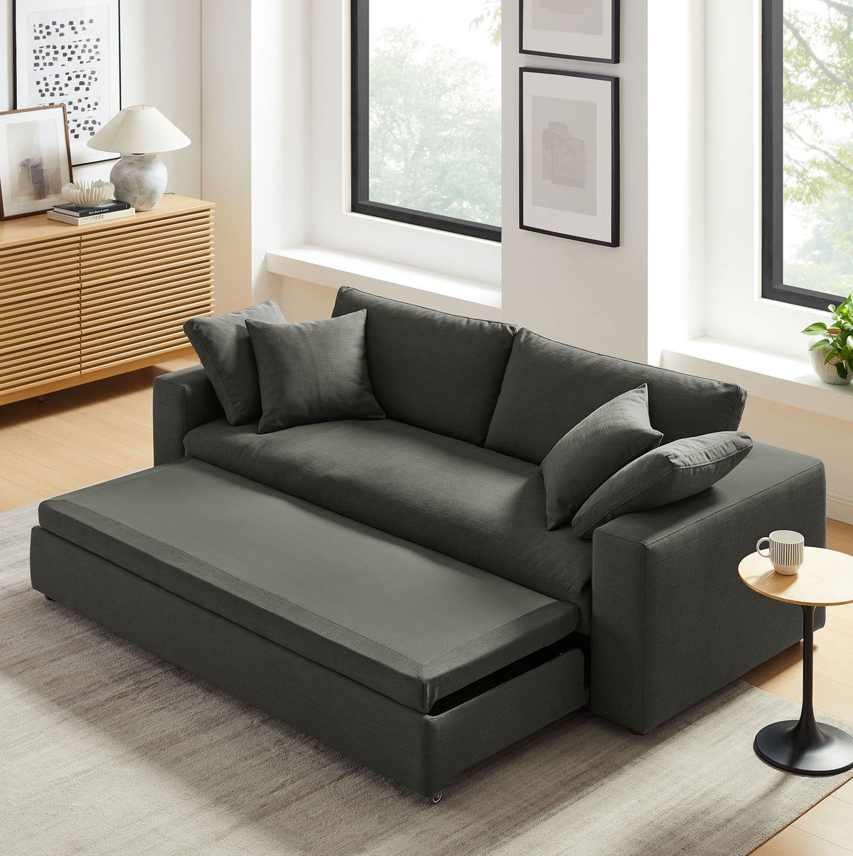Gray Commix sleeper sofa showing smooth pull-out mechanism transitioning into a bed || EEI-7080-GRY || front_angle_converted_room