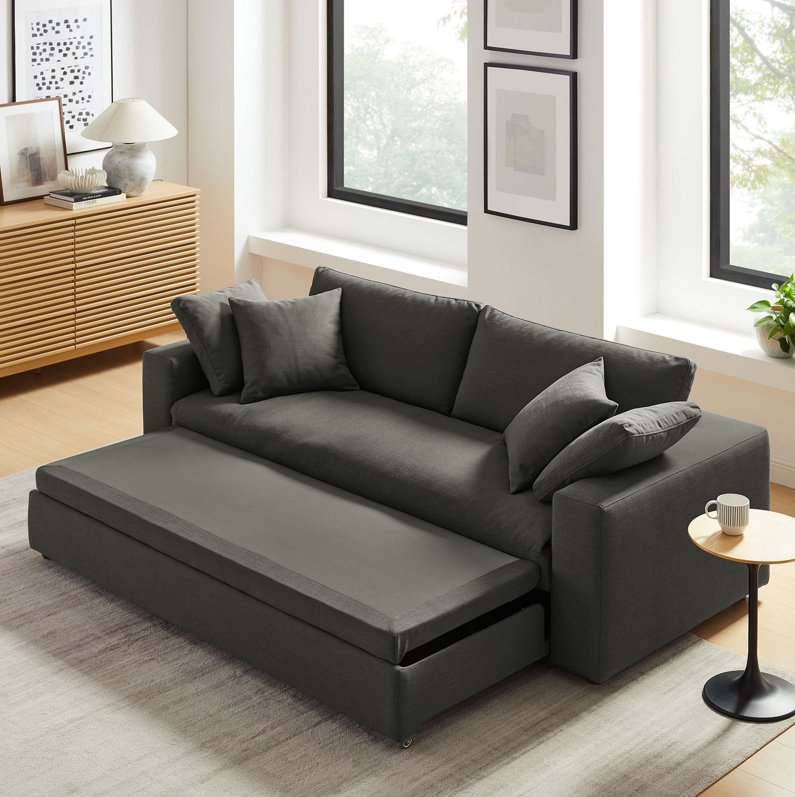 Gray Commix sleeper sofa showing smooth pull-out mechanism transitioning into a bed || EEI-7080-GRY || front_angle_converted_room