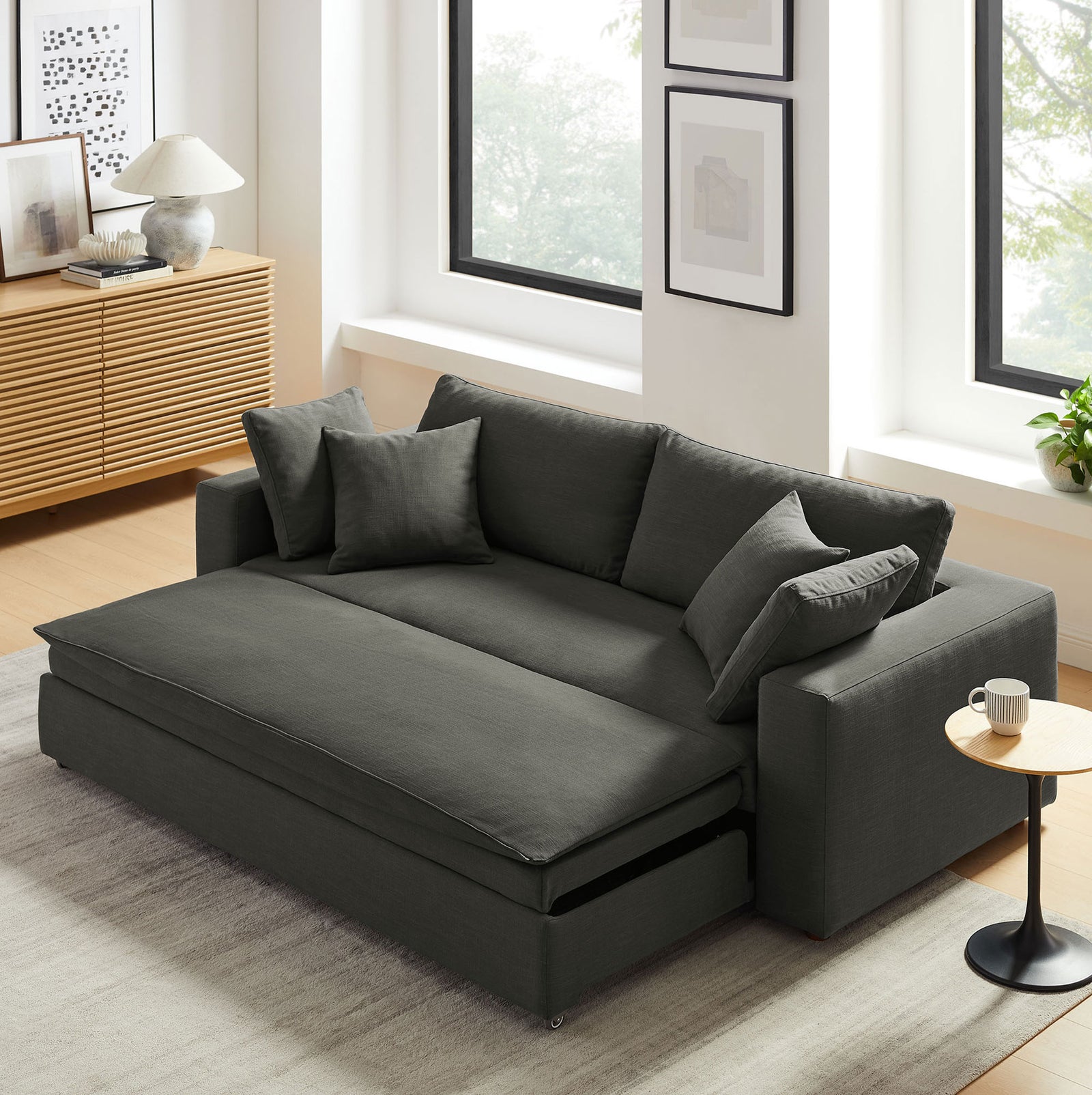 Spacious gray sleeper sofa with pull-out section fully extended to create a lounge-ready surface || EEI-7080-GRY || front_angle_converted_room