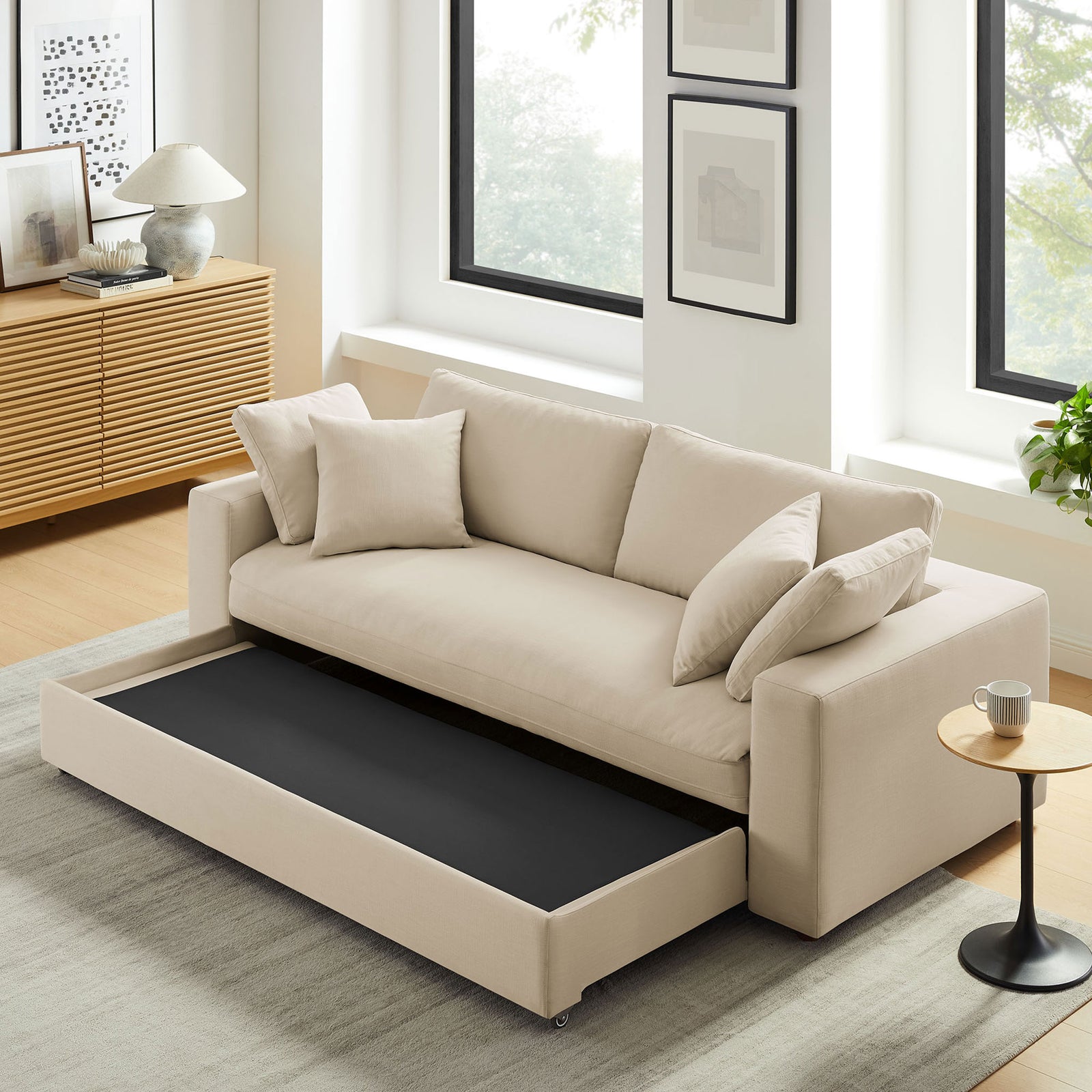 Sleeper sofa in a living room with the pull-out base extended, ready to transform into a guest bed || EEI-7080-LBG || front_angle_converted_room