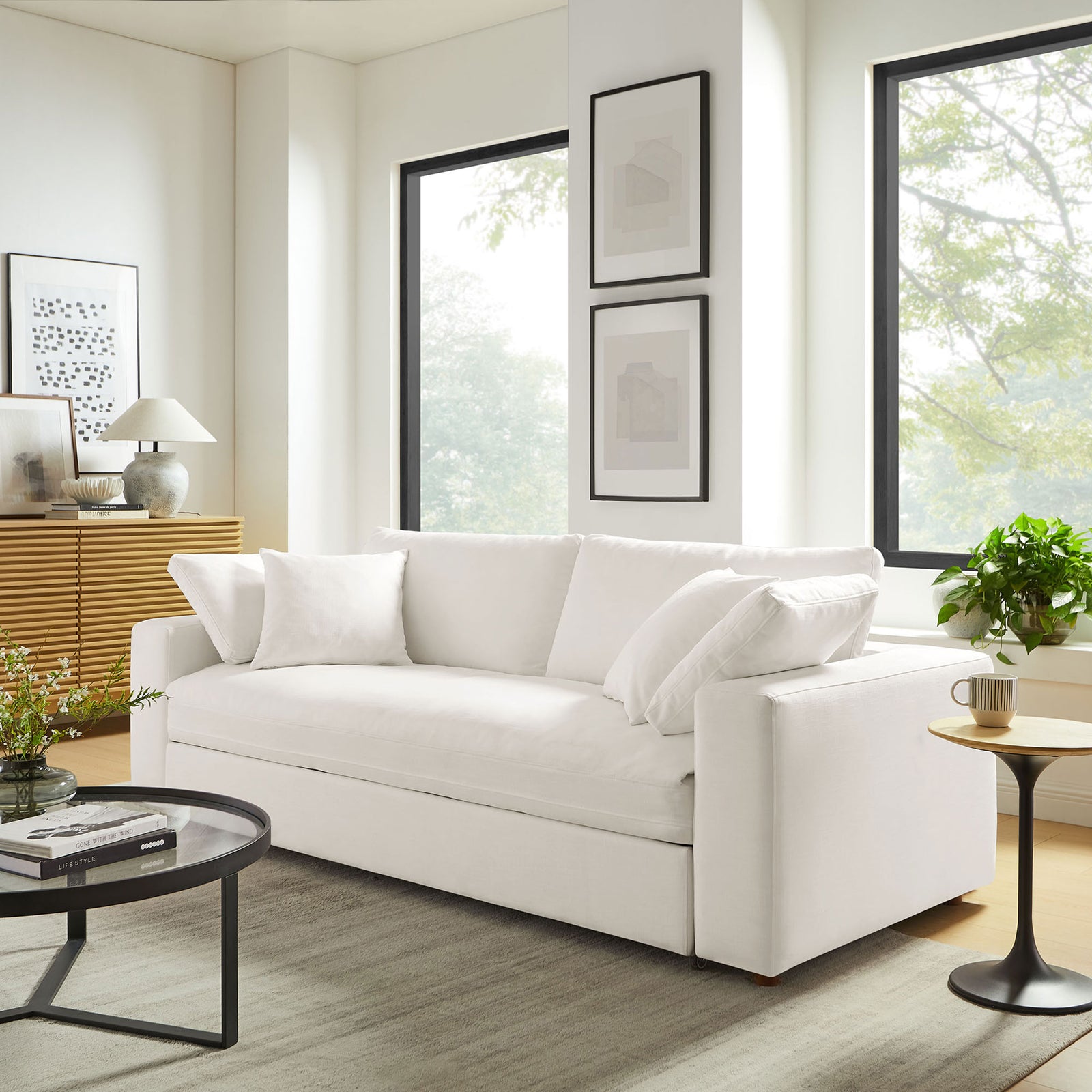 Commix sofa in pure white fabric creating an inviting focal point in a sunlit contemporary lounge || EEI-7080-PUW || front_angle_room