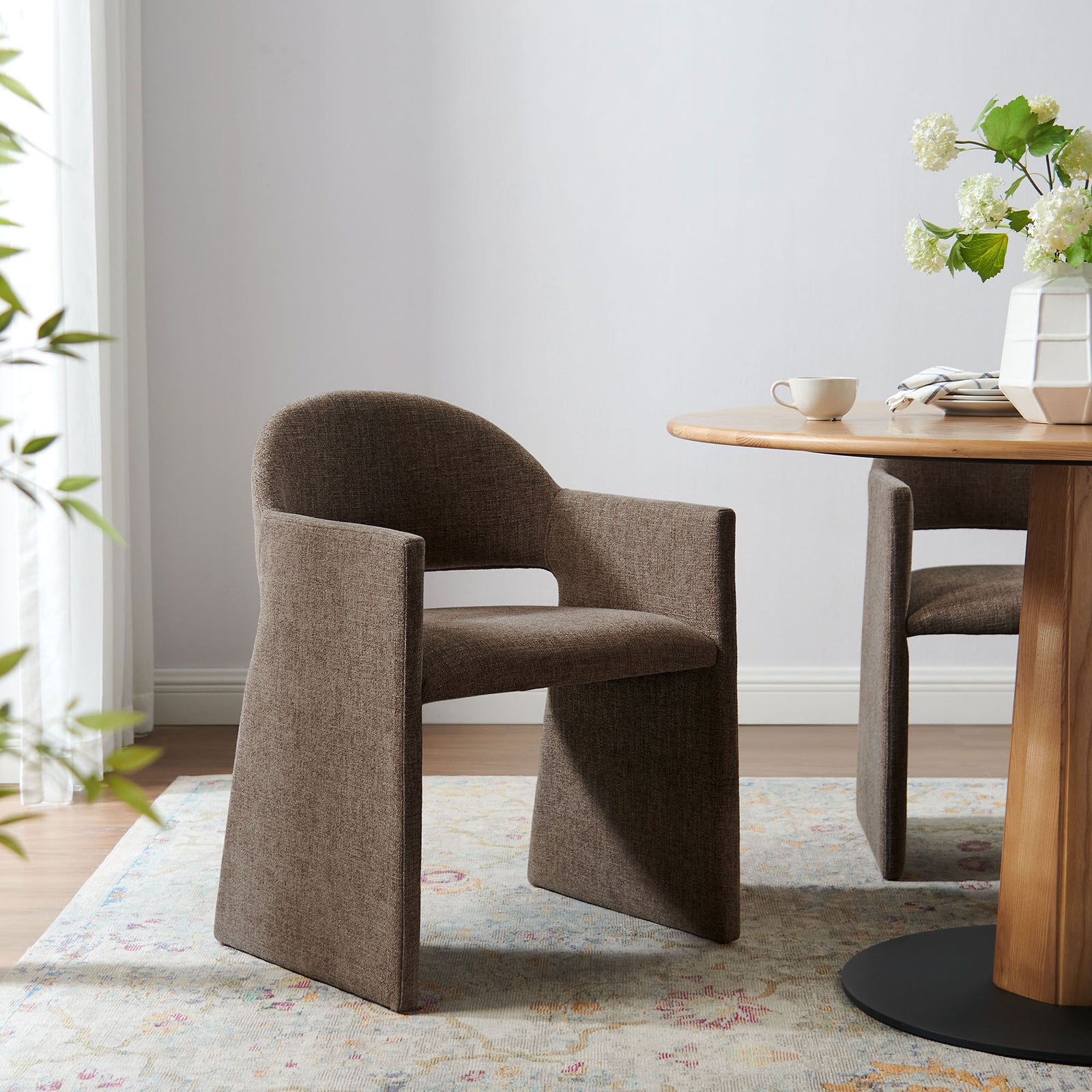 Mocha barrel back dining armchair paired with a wood pedestal table in an inviting dining nook || EEI-7082-MOC || front_angle_room