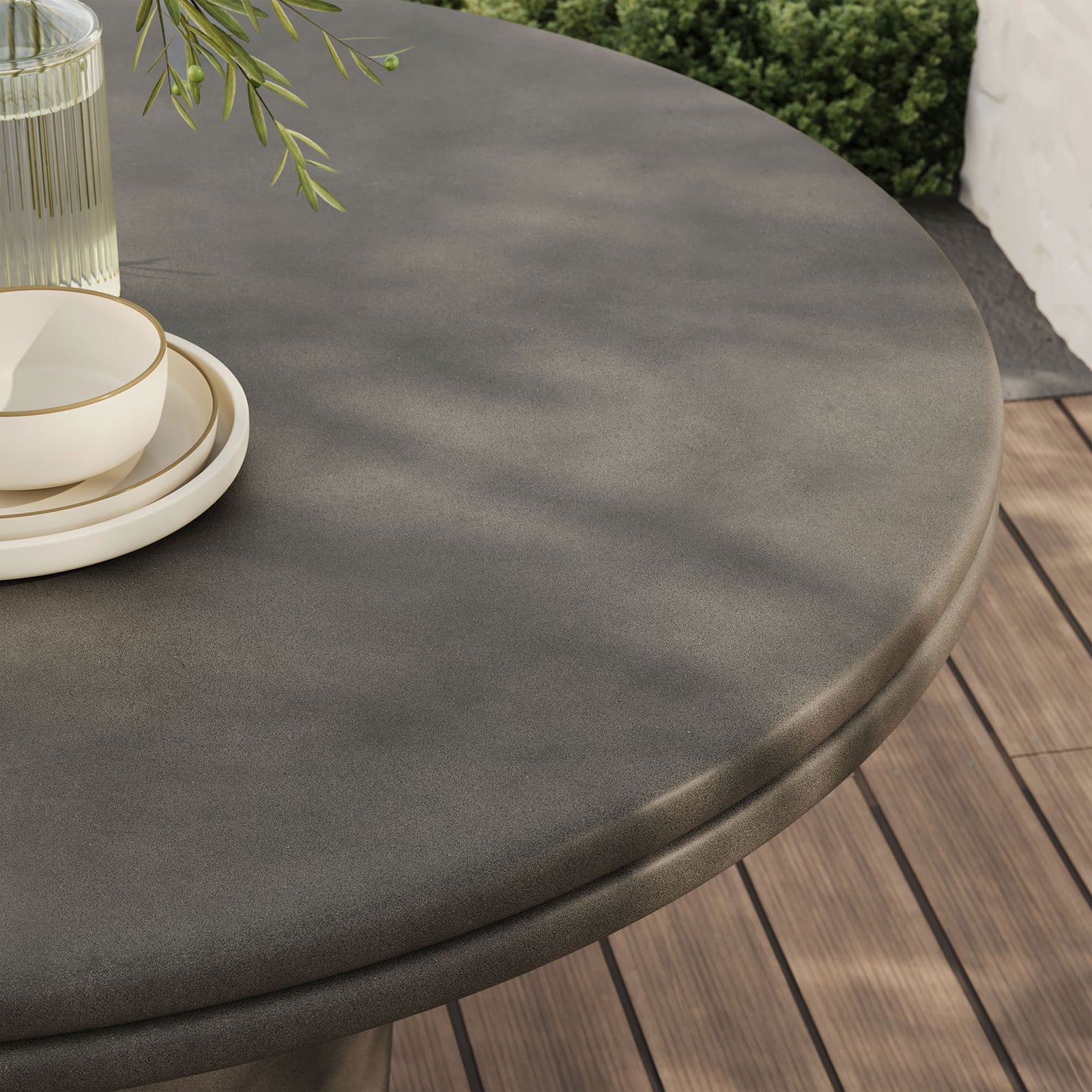 Gray concrete dining tabletop styled outdoors with dinnerware, showing smooth surface and lip edge || EEI-7087-GRY || detail_room